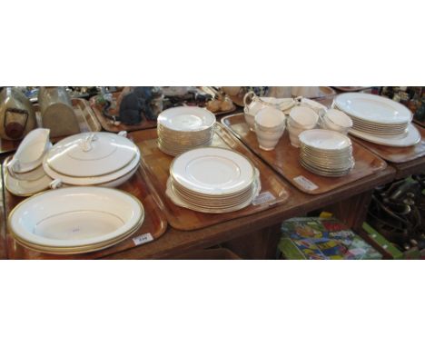 Four trays of Royal Worcester fine bone china tea and dinnerware items on a white ground with gilt banding, printed marks Mad