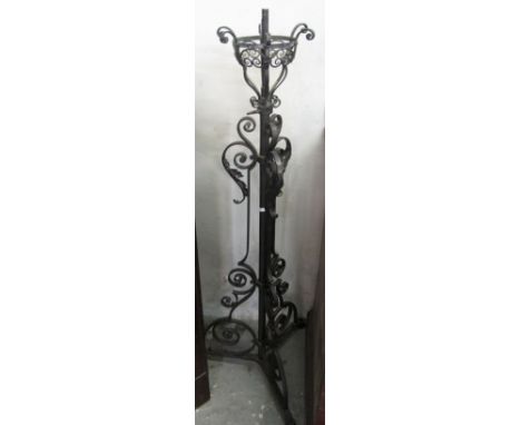 Heavy wrought iron scroll decorated triform lamp base.(B.P. 24% incl. VAT)