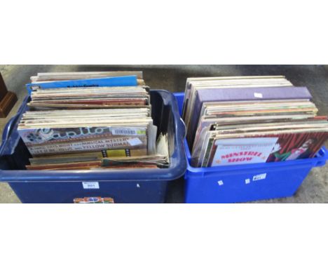 Two plastic boxes containing assorted vinyl LPs and 45 RPMs to include: Elvis Costello; Bruce Springsteen; Bob Dylan; Joe Jac