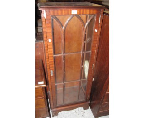 Small narrow mahogany single door, astragal glazed display cabinet on bracket feet.(B.P. 24% incl. VAT)