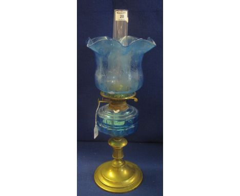 Brass double burner oil lamp with blue glass reservoir and brass pedestal base, etched blue glass shade and clear chimney. (B