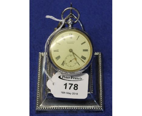 Silver pocket watch stand with beaded edge and wishbone support, loaded base with Sheffield hallmarks. Together with an engin