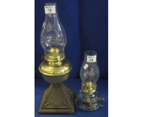 Brass single burner oil lamp with cast metal owl decorated base and clear chimney, together with a brass single burner chambe