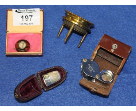 Leather cased Gowlands English made x 10 loupe, white metal thimble in leather case, brass framed magnifier on stand, tiny wa