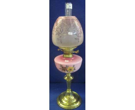Early 20th Century brass double burner oil lamp with ceramic floral reservoir, brass pedestal base, etched shade and clear ch