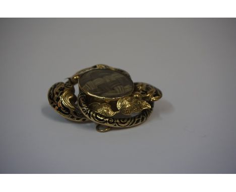 9ct Gold and Enamel Mourning Brooch, unmarked tested for 9ct, engraved to reverse, 13.5 grams, approximately 5cm diameter
