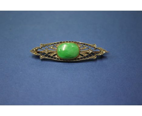 An Edwardian unmarked brooch set cabochon jade and mine cut diamonds.   Condition Report:  Brooch: 5cm x 1.5cmJade:1.6cm x 1.