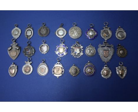A collection of fifty four 19th and 20th century silver, enamel and metal sporting medals.