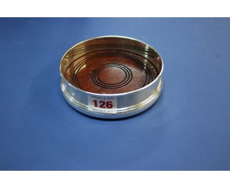 A silver bottle coaster, by W I Broadway & Co, Birmingham 1986, having engine turned decoration, 12.5cm.
