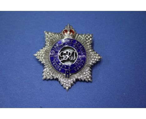 A George V Royal Indian Army Service badge, having enamel decoration.