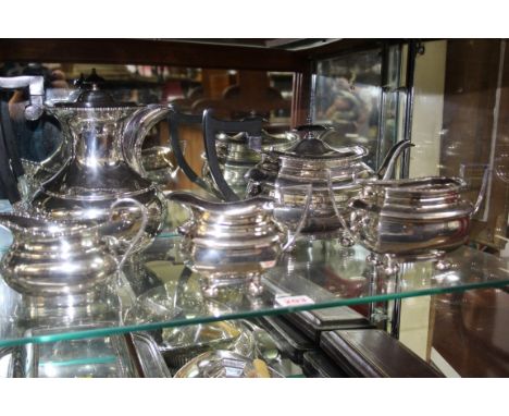 A Walker & Hall silver plated three piece tea set, and a silver plated hot water jug and matching milk jug 