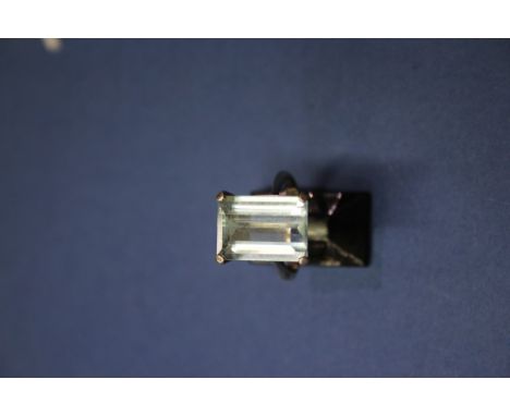 An 18ct white gold aquamarine ring, emerald cut. Condition Report: Ring size K. Stone measures 1.5cm x 1cm 