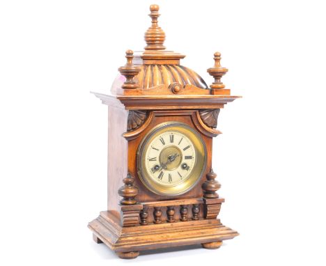 A 19th century Victorian era eight day mantel clock within a mahogany gothic case, together with a vienna regulator clock.&nb