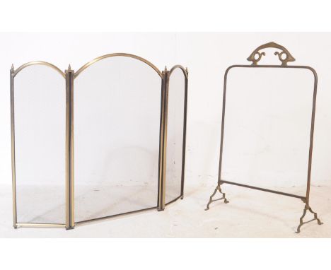 Two mid 20th century brass fire guards to include example with Arts and Crafts manner scroll handle detail to feet with glass