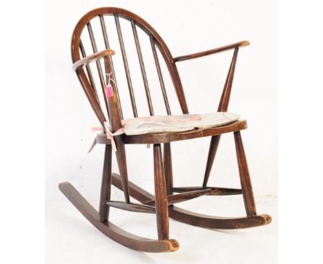 Ercol - Vintage 20th century childrens / teddy bear / dolls beech spindle back rocking chair by Ercol. With arched spindle ba