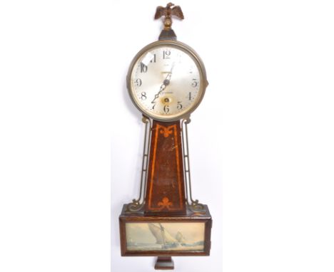 An early 20th century eight day sessions clock with a panel of sailing yachts to lower centre. Silver face with ebonised chap