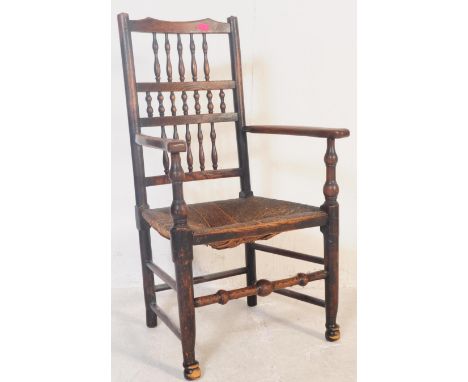 A 19th century&nbsp; North Country oak and rattan carver armchair. Having a reeded rattan seat, with shaped armrests above, r