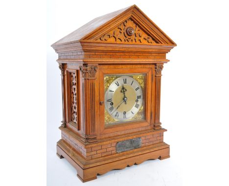 A large 20th century oak cased Westminster chiming bracket / mantel clock. Spire top oak case with silvered&nbsp; and gilt br