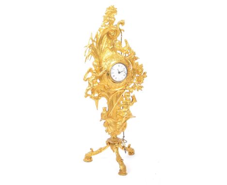 A 19th century Belle Epoche era ormolu Cartel clock on attachable stand. The clock being set within an ornate ormulu frame of