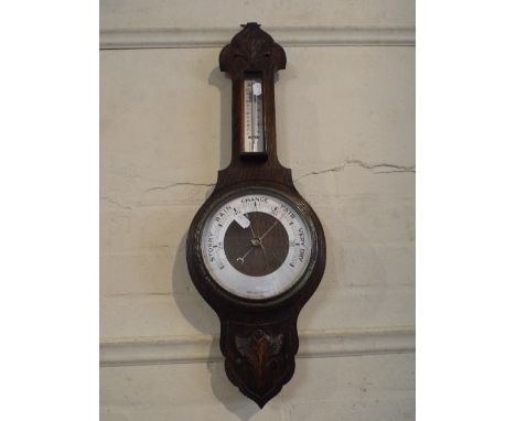 An Oak Aneroid Barometer with Temperature Scale (Cracked Glass). 