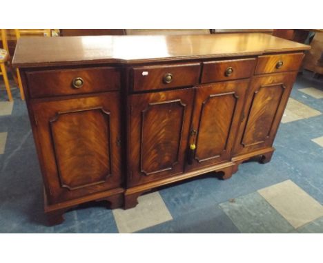 A Mahogany Break Front Dining Sideboard with Four Top Drawers Over Cupboard Base on Bracket Feet. 