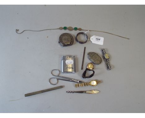 A Collection of Curios to Include Silver Plated Horseshoe Vesta, Three Wrist Watches, Silver Napkin Ring, Ronson Cigarette Li