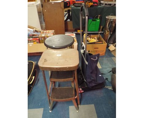 A Circular Topped Stroll, Step Stool, Shopping Trolley.