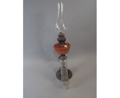 A Pretty Late Victorian Oil Lamp and Two Glass Chimneys.