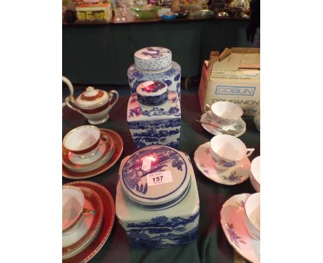 Two Reproduction Ringtons Tea Blue and White Caddies and An Oriental Blue and White Tea Caddy.