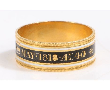 A 18 carat gold 19th Century mourning ring, with a white and black enamel band named to Lady Caroline Rushout OB 22 May 1818,