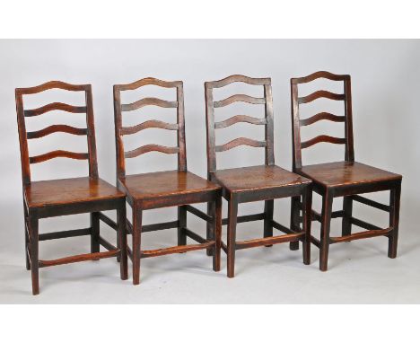 A set of four George III oak and elm ladder back chairs, circa 1790, each with a a row of four arched splats above a solid se