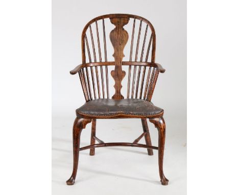 A 19th Century ash Windsor chair, the arched top rail with central splat and spindles above a later pad seat covering a commo