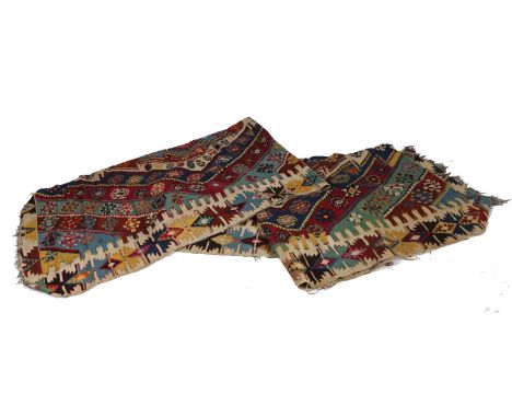 An Anatolian Kilim, with a three central guls with bands of diamond lozenges surrounding set with various different guls, wit