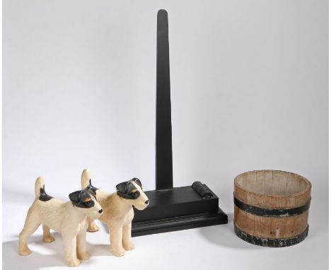 A pair of porcelain model dogs, Terriers, together with a modern charger stand in the 19th Century taste and an oak cheese mo