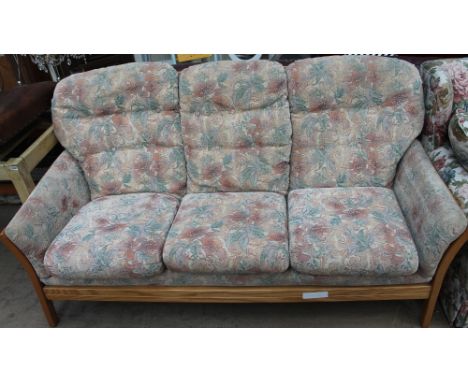 An Ercol upholstered three-seater settee