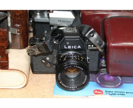 A Leica R3 electronic 35mm camera, No.1466987, together with a Nikon F 35mm camera, Konica auto reflex, The QWray eleven bino