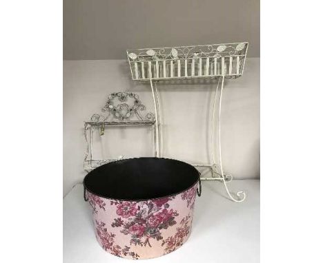 A large circular metal planter and a white metal plant trough & wall shelf 