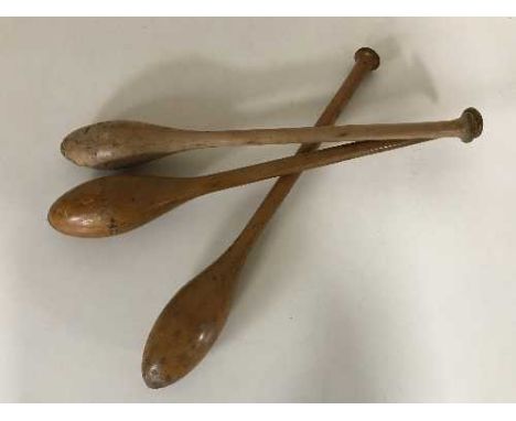 Three vintage wooden juggling batons 