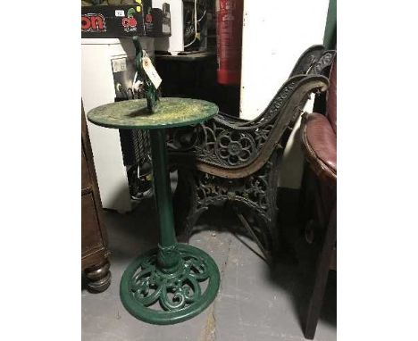 Two pairs of cast iron bench ends and sun dial 