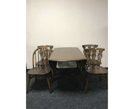 An Ercol drop leaf table and four chairs 