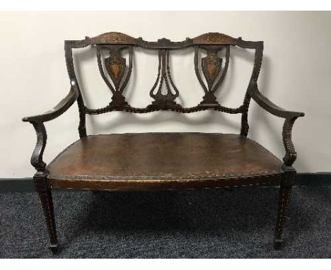 A Victorian inlaid mahogany two seater bench 
