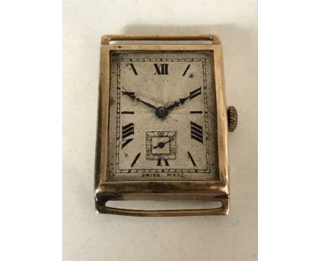 A vintage oblong gold watch, missing glass