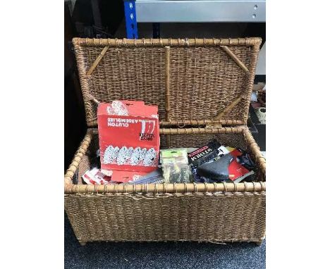 A wicker hamper of car and bike parts 