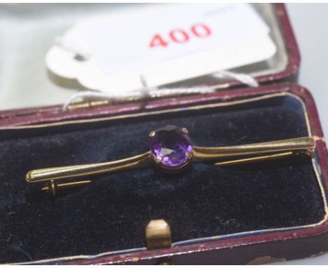 An Edwardian 9ct gold amethyst set bar brooch, cased