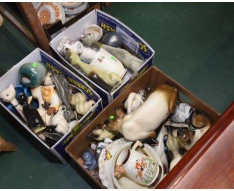 Three boxes containing a quantity of porcelain and pottery models of Siamese cats and a hunting jug with impressed marks KSP 