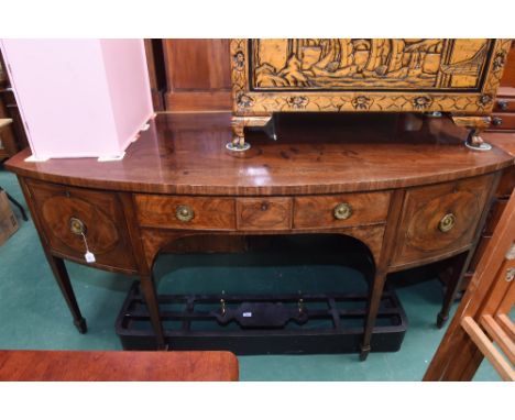 A George III bow-fronted mahogany sideboard, c.1800, fitted to the centre with a drawer with oval inlaid panel flanked by a c