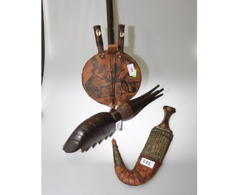 A Qajar dagger; tog. with a tribal carving and a tribal stringed instrument