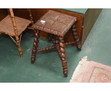 A carved oak stool