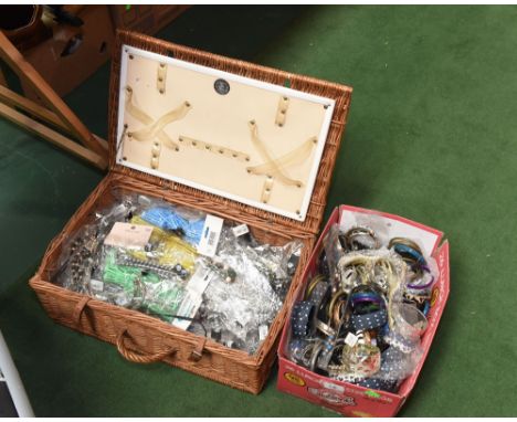 A wicker hamper and a box containing a quantity of costume jewellery