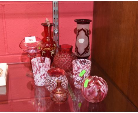 A collection of cranberry coloured glass including a pair of mottled glass tumblers, a ruby fash acid etched vase, a Venetian